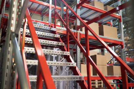 A red mezzanine staircase and handrails.